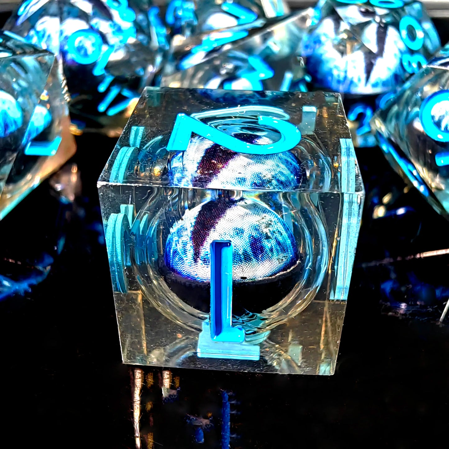 DnD Dice Set - Resin Dice with Spinning Dragon Eye Core, Transparent Blue Text, Perfect for Tabletop RPG & Board Games