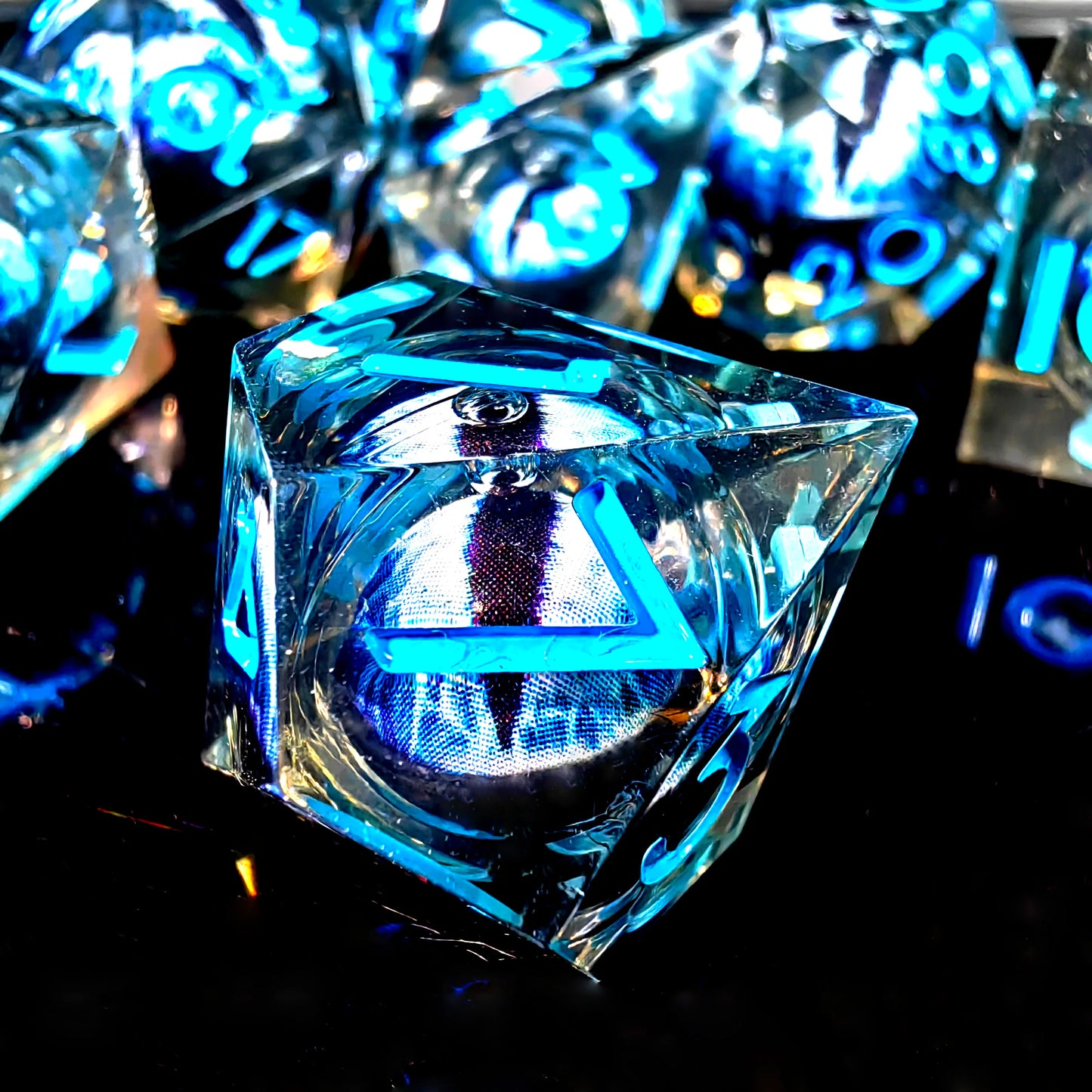 DnD Dice Set - Resin Dice with Spinning Dragon Eye Core, Transparent Blue Text, Perfect for Tabletop RPG & Board Games